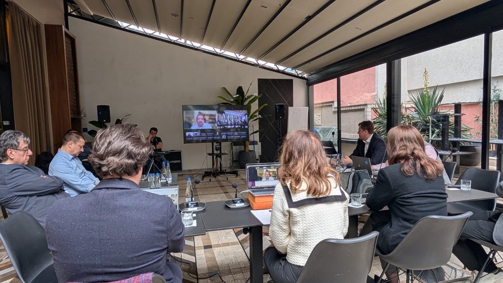 Photograph of attendees and speakers at the roundtable