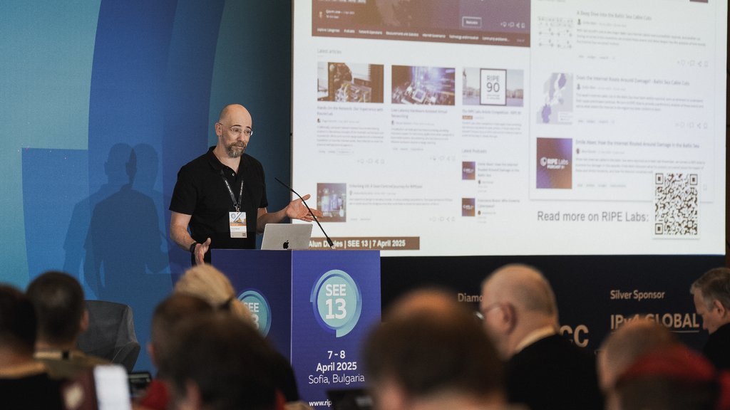 a photo of Alun Davies giving a presentation