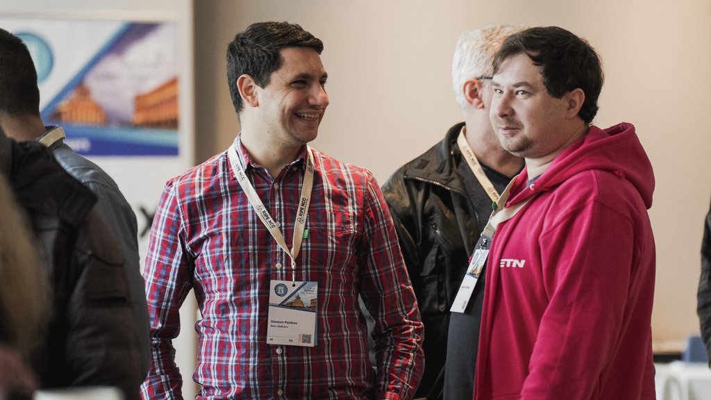 a photo of attendees standing in the line for coffee