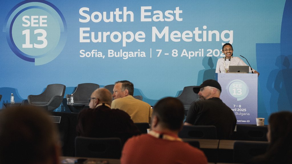 A photo of Rita Ingabire giving a presentation