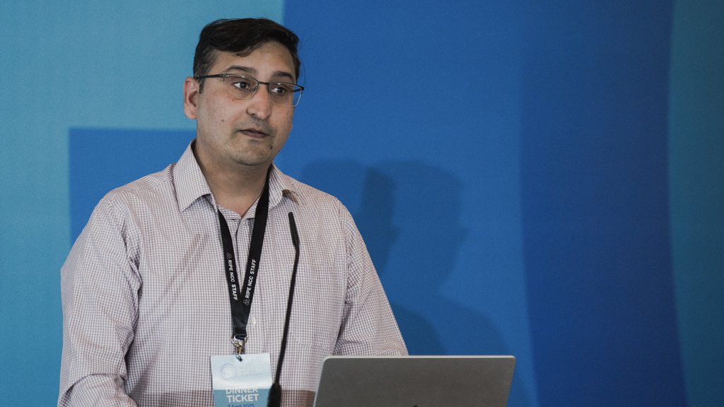 Qasim Lone giving a presentation