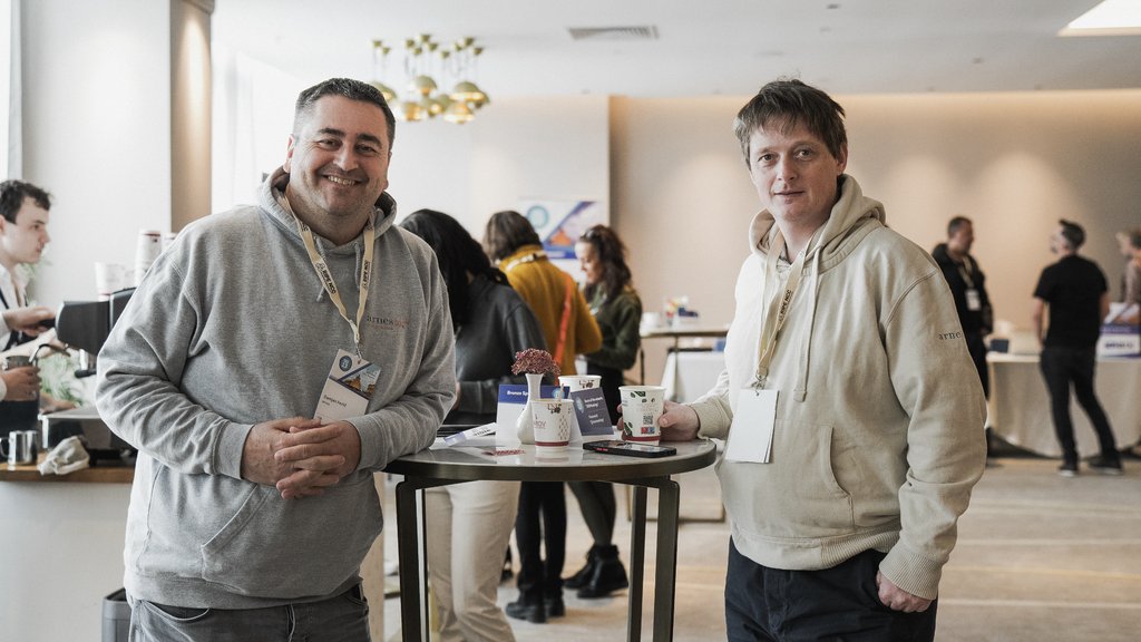 a photo of two men smiling in the coffee area
